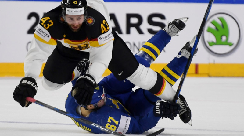 Vācijas un Zviedrijas izlases hokejistu divcīņa
Foto: Patrik Stollarz / AFP Scanpix